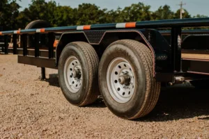 Close-up view of the Super Duty Utility SDU104 Trailer tires featuring heavy-duty tread design for enhanced durability and performance on various terrains.